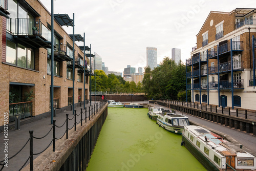 Photography Limehouse canal with narrowboats and canary wharf skyline