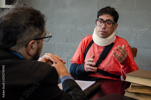 Injured Client Gesturing with Hands While Explaining Case to Attorney