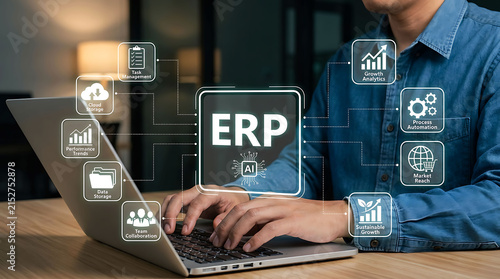 Businessman using ERP software system with AI integration on laptop