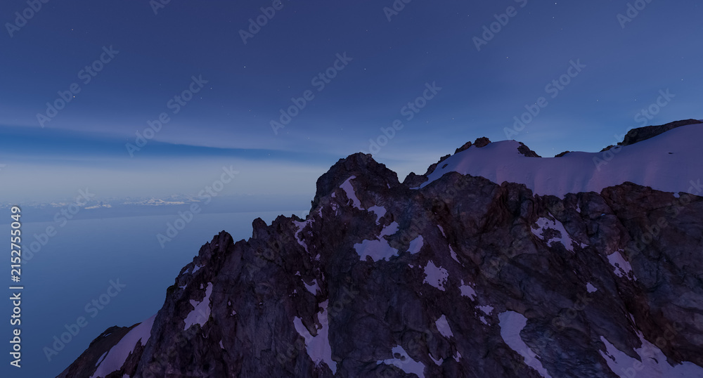 Fototapeta premium Snowy Mountain Ridge at Twilight Over Ocean Horizon With Stars — 3D Rendering