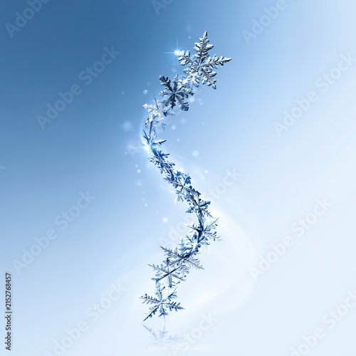 A beautiful, conceptual macro shot of a swirling trail of snowflakes representing frozen breath against a soft, light blue gradient background.