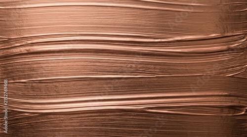 Bronze metallic paint texture background with horizontal brush strokes