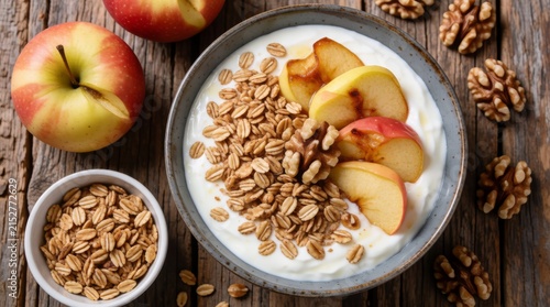 Healthy breakfast yogurt bowl with fresh fruit granola and nuts rustic wooden table setting