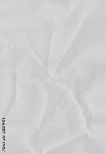 Konstfotografi Plain empty white crumpled paper texture for abstract background or clean backdrop in vertical orientation with gentle soft folds and creases on surface