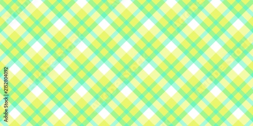 Seamless diagonal plaid pattern background with vibrant yellow and mint green gingham checks for summer or spring textile design.