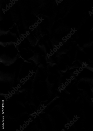 Fotografía Dark crumpled paper texture offers a dramatic and versatile background, perfect for creating moody designs and adding depth to visual content