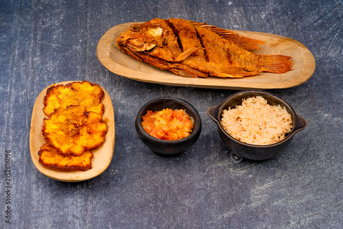 Fried tilapia fish with coconut rice and stew
