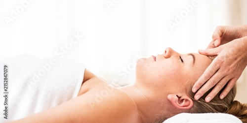Cuadro en lienzo Person receiving a relaxing facial massage in a serene spa setting