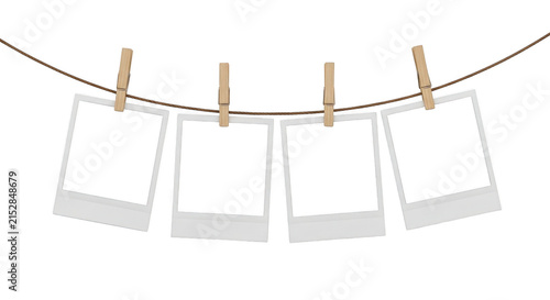 Four blank photo frames hanging on a rope with wooden clips isolated on transparent background