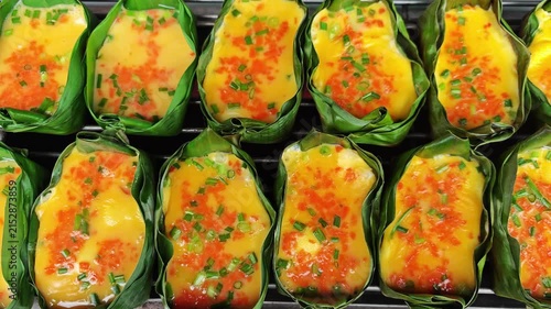 Grilled eggs in banana leaves