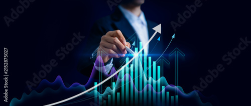 Businessman pointing arrow graph corporate future growth plan and target,Business development to success target,finance,marketing,investment and growing growth concept