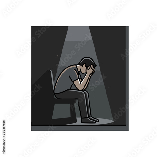 Man sitting alone in spotlight feeling distressed.