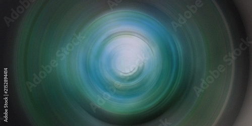 Photography Abstract circular motion vortex effect with blue and green light rays