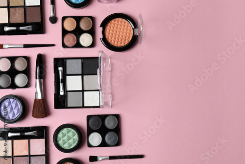 Foto Cosmetics and makeup brushes on a pink background, beauty and skincare essentials, flat lay composition