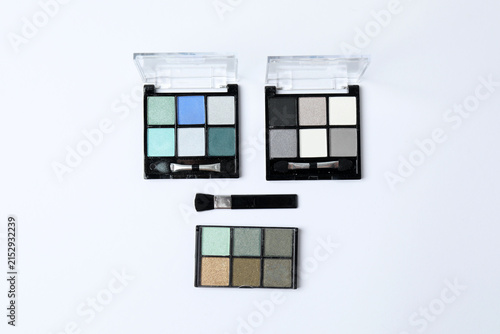 Canvas Print Cosmetics and makeup brushes on a white background, essential beauty and skincare products, flat lay composition