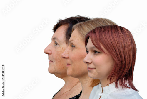 Cuadro en lienzo Profile side faces view of serious attractive grandmother posing with middle aged daughter and teen granddaughter standing together in row, three generations of women, family unity, bonding and ties