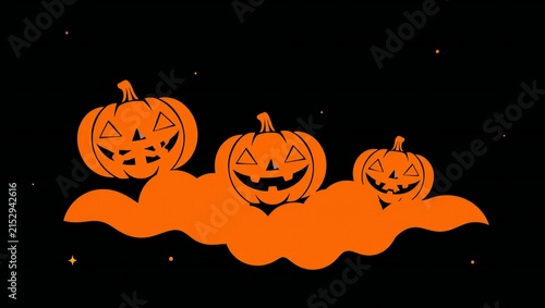 Three spooky orange jack o lantern pumpkins floating on a cloud in the dark night sky