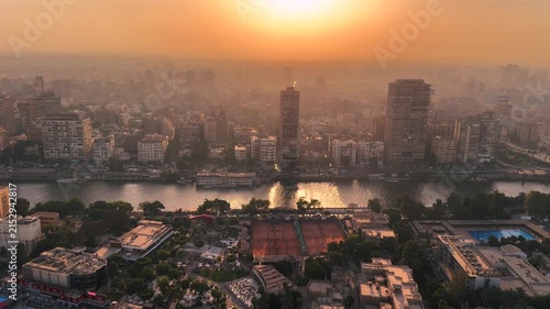 Aerial Panorama of Cairo and Nile River at Vivid Orange Sunset with Giza Skyline