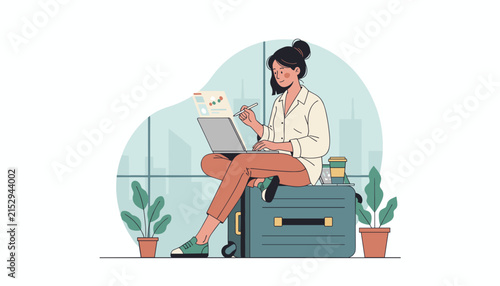 Successful female professional working on her laptop while sitting on a suitcase in an office with a city view.