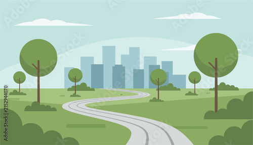 Winding grey road leading through a green grassy field towards a distant city skyline under a clear blue sky in summer.