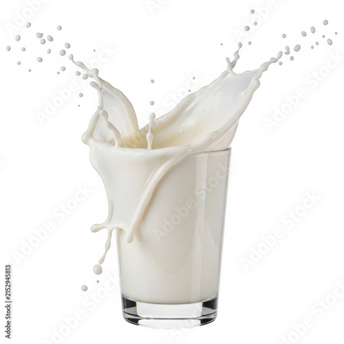 Milk pouring from a carton into a glass