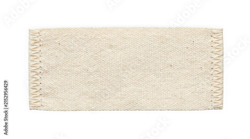 Beige woven fabric patch with decorative zigzag stitched edges isolated on white background