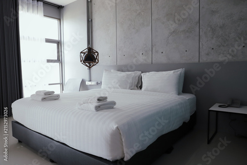 Konstfotografi Bedroom hotel room bed white bedding modern interior concrete wall minimal guest