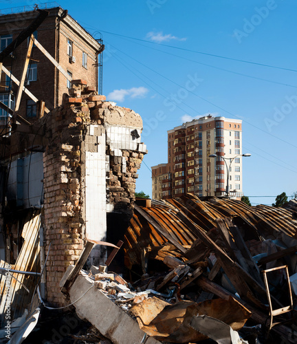 War-torn Kyiv: destroyed building and debris amid modern residential architecture