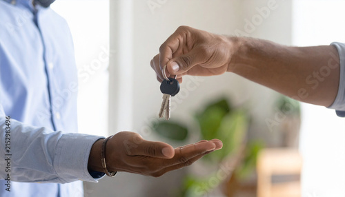 Two people exchanging a set of keys