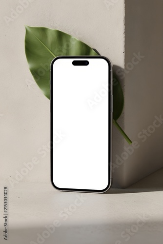 Elegant Smartphone Mockup with Leaf on Concrete Wall