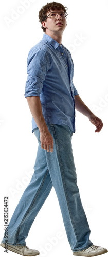 Full body young man walking in blue casual outfit isolated on transparent background. Concept of casual clothing catalogs, fashion banners, online stores and seasonal sales.
