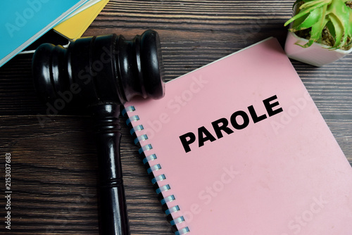 Foto Concept of parole on book with judge gavel isolated on Wooden Table