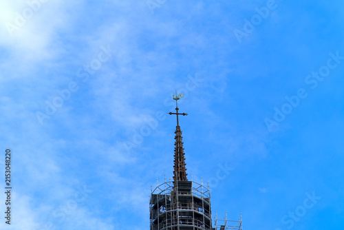 Tower of Notre Dame cathedral surrounded by scaffolding at the old town of French city of Rouen on a summer day. Photo taken July 13th, 2026, Rouen, Normandie, France.
