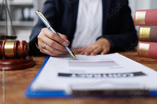 Legal law, advice and justice concept,Business lawyer working about legal legislation in courtroom to help their customer.