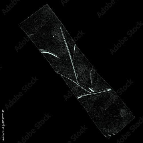 Diagonal black duct tape strip with branching diagonal shiny folds on black background, realistic adhesive tape isolated