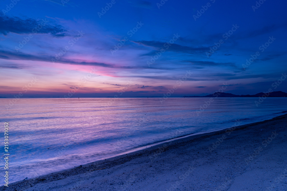 Fototapeta premium Twilight seascape with a delicate sky gradient at Ariake Beach in Kagawa Prefecture, Japan.