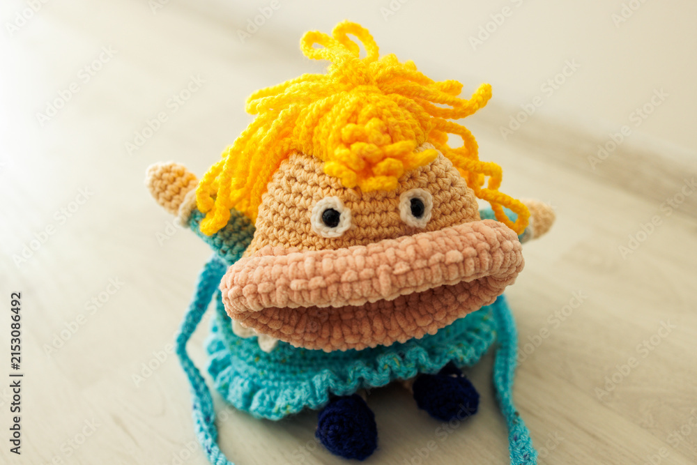 Fototapeta premium Crochet doll with big mouth. This photo has been taken in Kladno, Czech Republic, August 2026