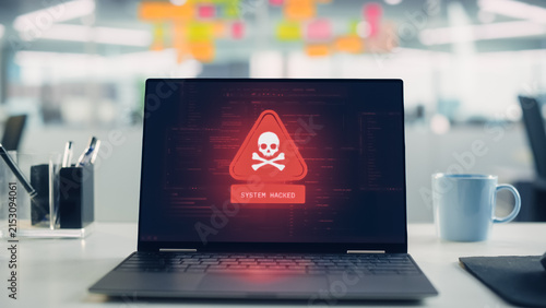 Office Laptop Suffers Hacking Cyberattack and Security Alerts, Malware Infection, Ransomware Risk, and Data Theft. System Compromise Warnings on Screen, Cybersecurity Danger for Business Networks.