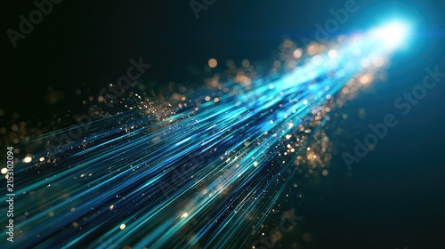 Streaks of light with glowing particles zoom across a dark background