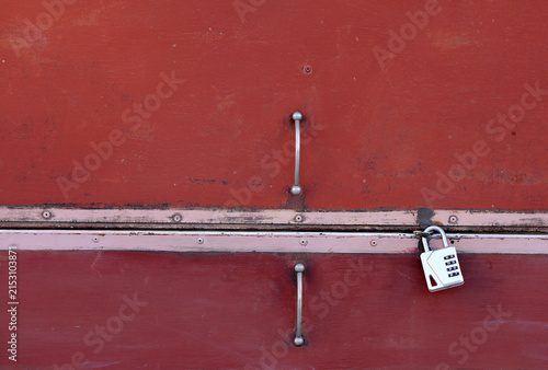 Konstfotografi Red metal door secured with combination lock