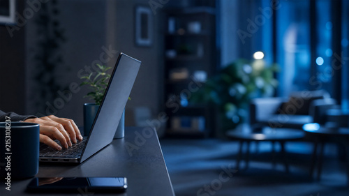 Remote Worker Typing on Laptop at Home Desk with Copy Space