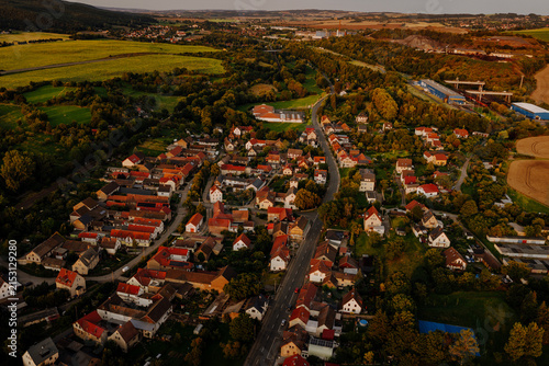 Aerial drone view of the traditional rural German village Gorndorf with red roofs at sunset