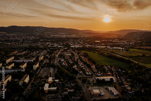 Aerial view of a German town at sunset with a dramatic cloudy sky