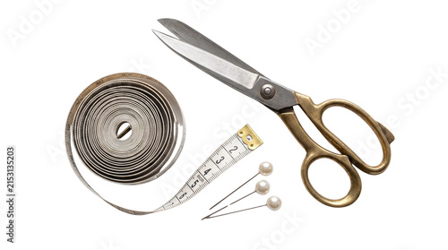 Vintage brass tailor scissors with sewing tools, professional dressmaker shears and measuring tape, sewing kit on white background