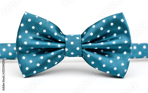 Stylish blue bow tie with white polka dots isolated on white background. Fashion accessory for men. Concept for party or celebration outfit, elegant event.