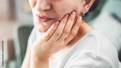 Photography Young woman suffering from toothache