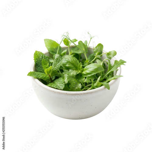 Fresh mixed herbs in a white bowl