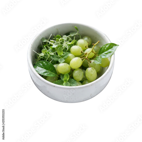 Green grapes and herbs in a bowl on transparent background