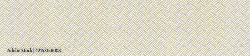Beige and white herringbone fabric texture showcasing a subtle woven chevron design