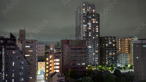 Illuminated High-Rise Apartment Buildings at Night